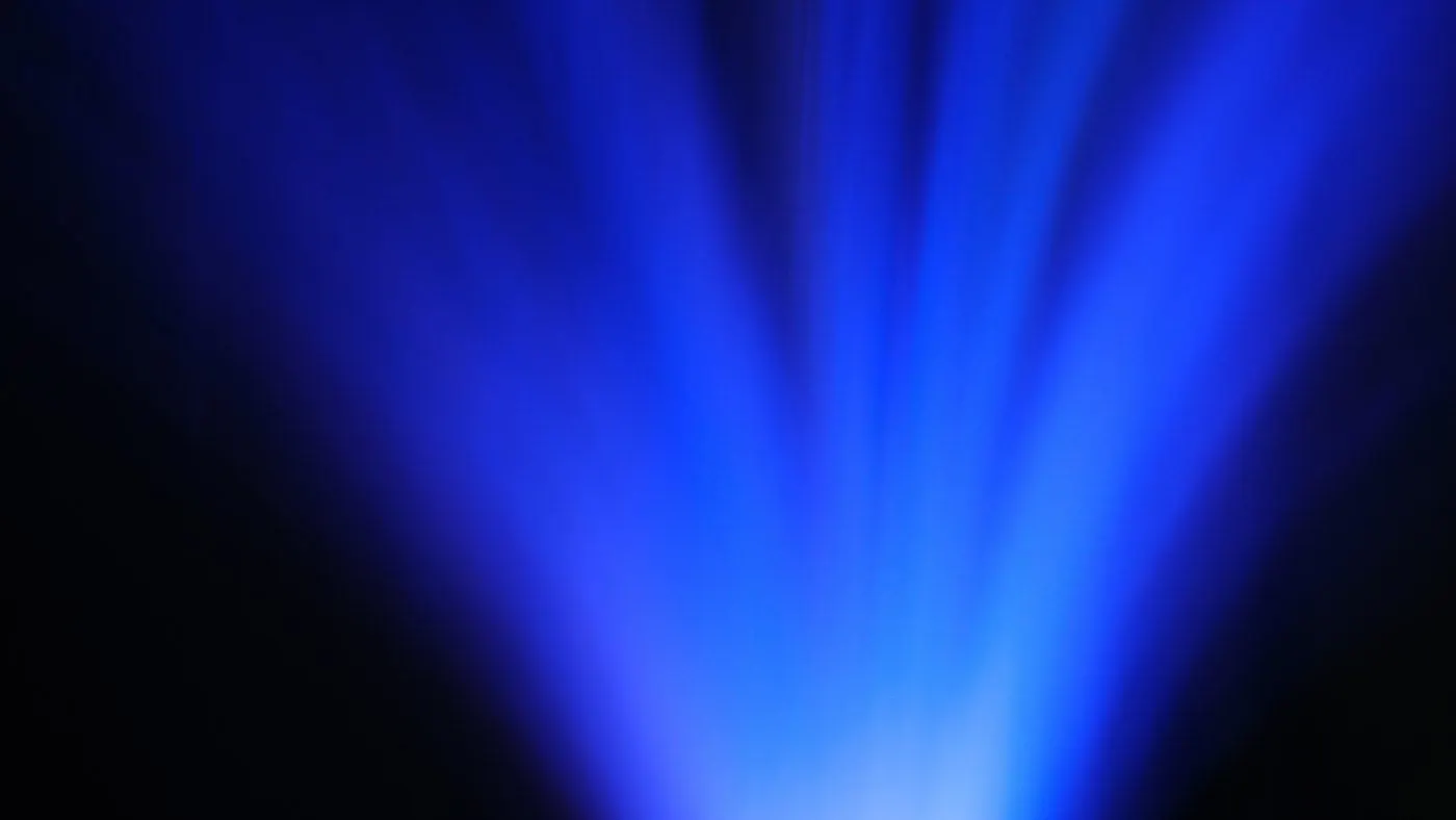 Soft beams of blue light in a dark space