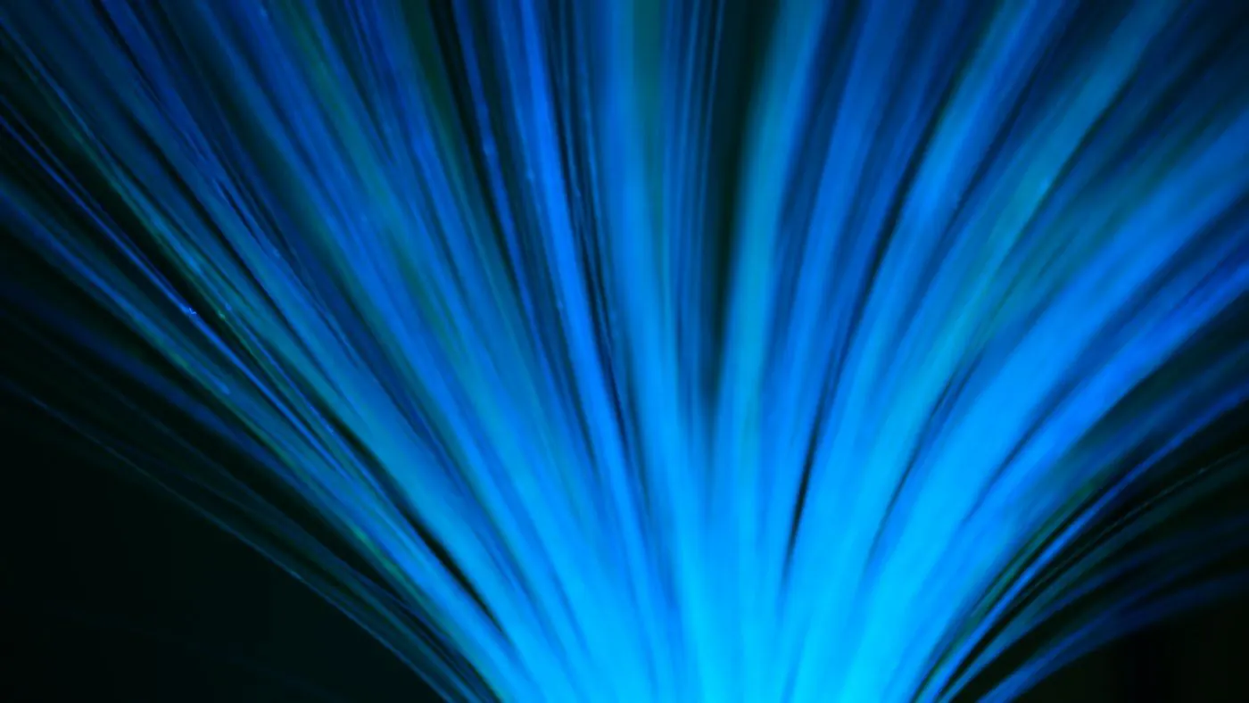 Streaks of blue light suggesting fast-moving data